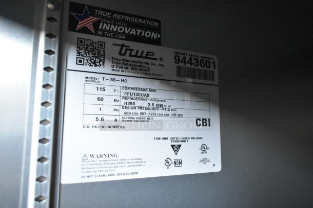 2018 True T-35-HC stainless steel commercial 2-door cooler with poly-coated racks. Features 115 volts, 1 phase.