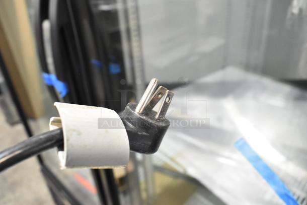 Delfield 406CA-DHL-DD1 stainless steel undercounter cooler, single door, on casters. 115V, 1 phase power plug shown.