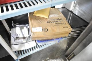 Tiered lot featuring a Choice cup and lid organizer in a labeled box, accompanied by drop-in bin lids and assorted items.