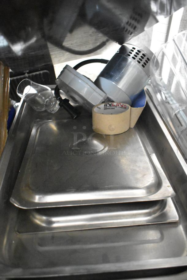 Assorted lot featuring a choice cup and lid organizer, drop-in bin lids, and kitchen utensils. Good condition.