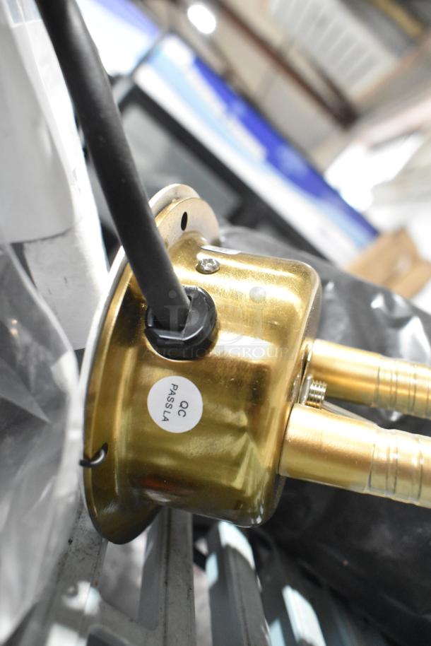 CK7413B0698 metal warming lamp with two heads, 120 volts, 1 phase; features QC pass label indicating quality check.