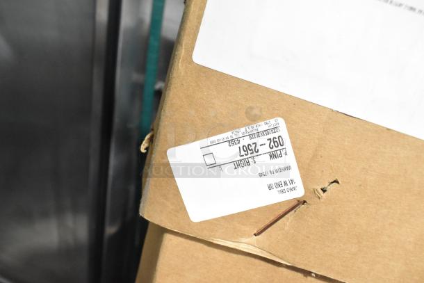 Brown cardboard box containing the BRAND NEW SCRATCH AND DENT PD-8 Glass Door, with visible shipping labels.