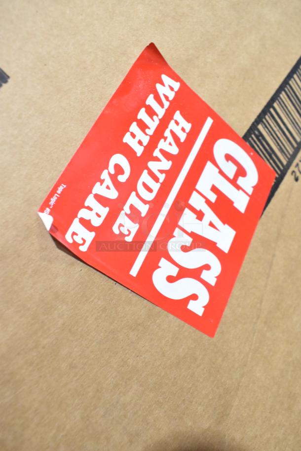 Red sticker on box reading "GLASS HANDLE WITH CARE" for PD-8 glass door item.