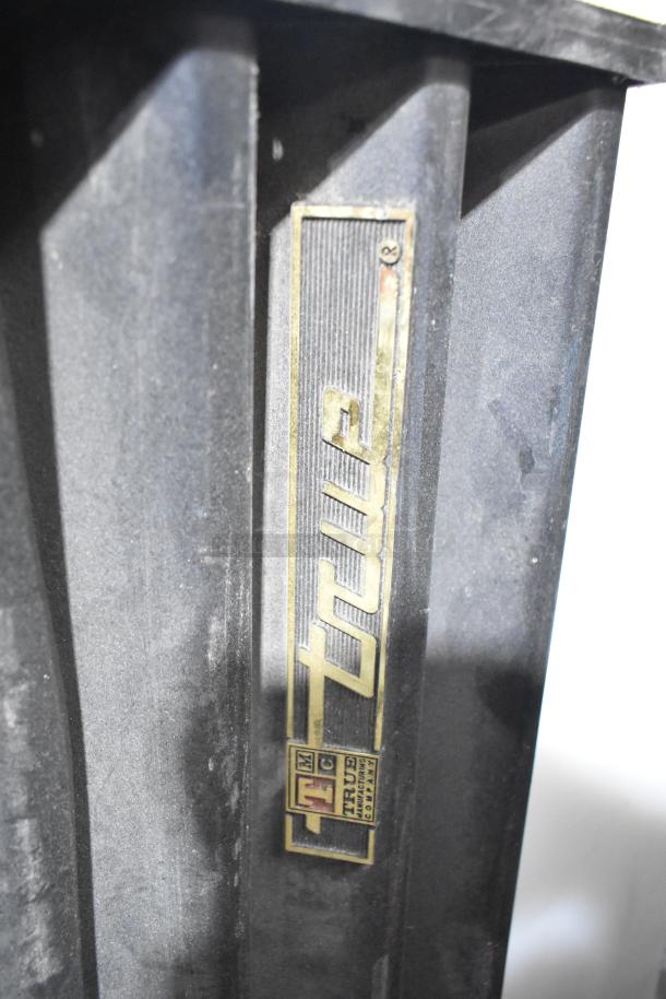 6 various items featuring True cooler vent covers, black, marked with True logo. Good condition. Auction includes bid multiplier.