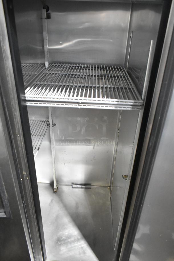 True T-35-HC stainless steel commercial cooler, two doors, poly coated racks, 115 volts, 1 phase, interior view.