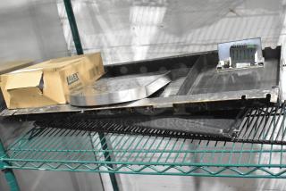 Auction lot with metal pieces and Lavex 712SNRSS Stainless Steel Wall Mount Sanitary Napkin Receptacle. Includes original packaging.