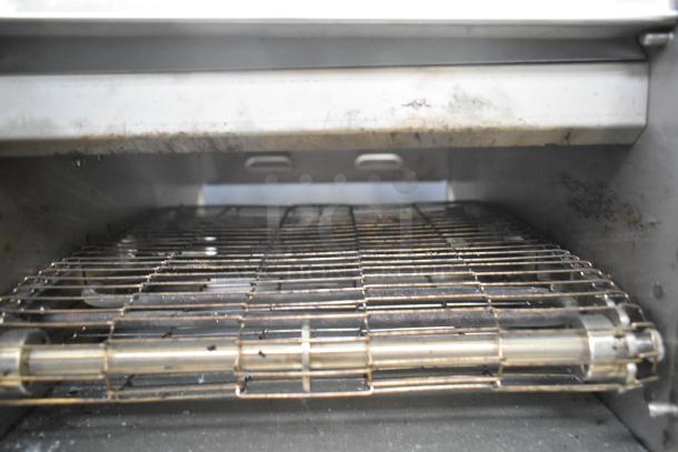 Winco Spectrum ECT-300 stainless steel commercial countertop conveyor oven, used, 120 volts, 1 phase. Interior view.