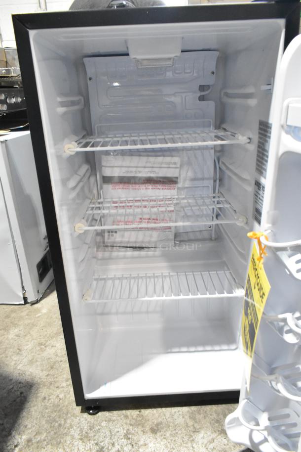 Brand new Micro Fridge 3.3MF4R metal mini fridge, 115 volts, 1 phase. Interior racks visible, minor scratch and dent.