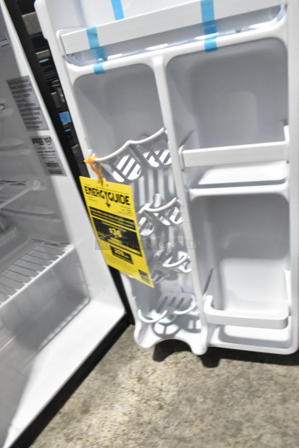 BRAND NEW Micro Fridge 3.3MF4R Mini Fridge, 115V, 1 Phase. Energy guide label visible. Some scratches and dents noted.