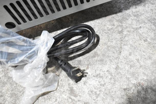 BRAND NEW SCRATCH AND DENT! Frigidaire FSIC-1980 stainless steel ice machine, 115V, self-contained, power cord shown.