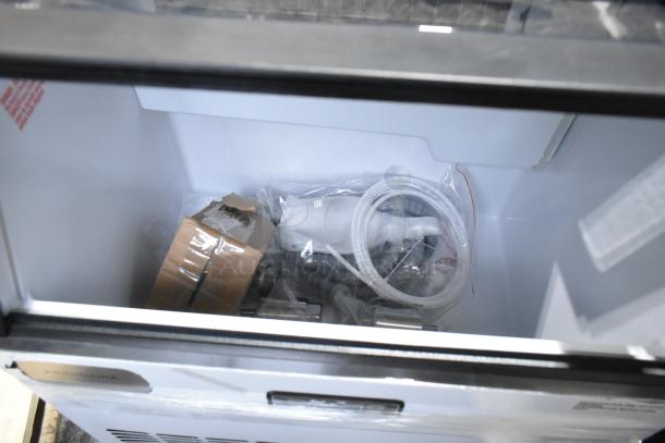 Frigidaire FSIC-1980 stainless steel ice machine, new with scratches and dents. Includes hoses and components in packaging.