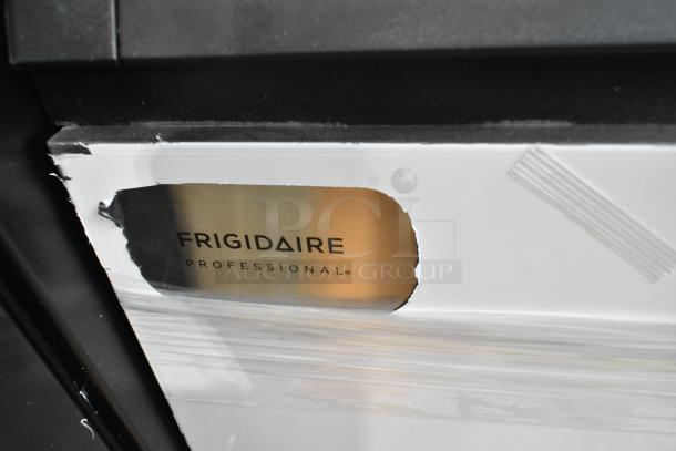 Brand new Frigidaire Professional FSIC-1980 ice machine, stainless steel, 115V, self-contained, with visible label and minor scratch.