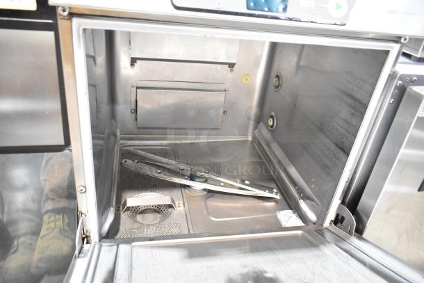 Hobart Advansys stainless steel undercounter dishwasher, open view, showcasing interior with rotating spray arms.