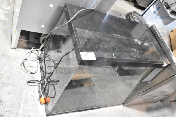 Metal countertop dry merchandiser display case, glass front, 115 Volts, 1 Phase, includes visible wiring, label "136".