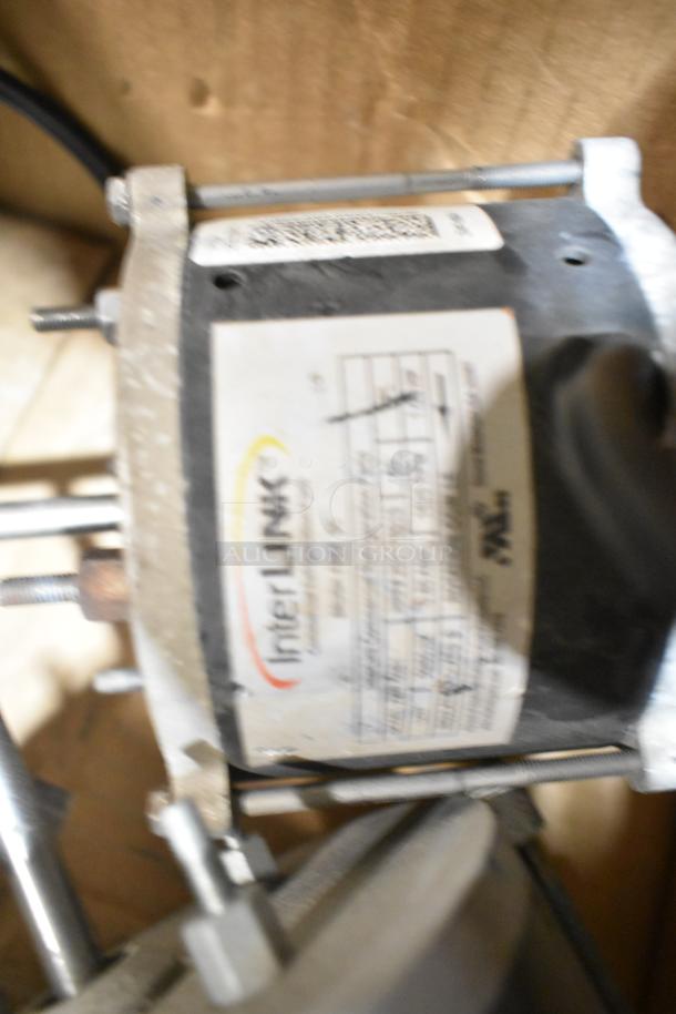 Three various motors with visible label indicating "InterLINK" brand. Item in used condition; additional details on the label.