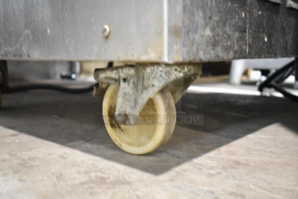 Coldelite LB502 batch freezer on commercial casters, stainless steel, 208-230V, 3 phase, visible wear on wheel.