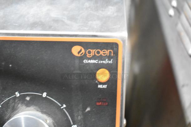 Groen stainless steel commercial floor steam kettle control panel with heat setting and branding.
