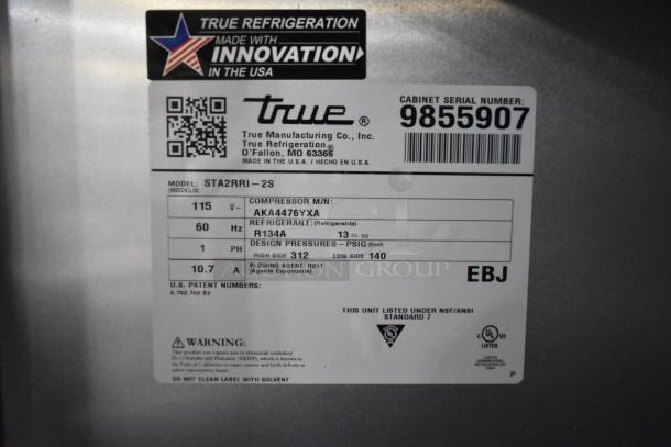 2019 True STA2RRI-2S stainless steel 2-door commercial cooler, 115V, 1 phase. Features include model, serial number, and voltage details.