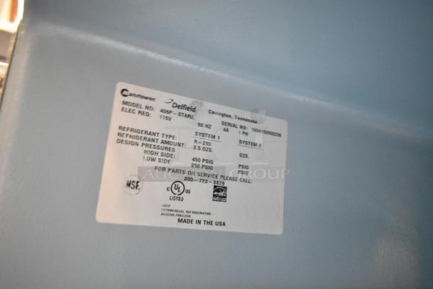 Label on 2016 Delfield 406P-STAR2 undercounter cooler, 115V, NSF, UL listed. Model, refrigerant, and service info visible.