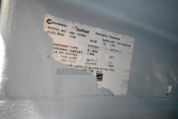 Delfield 406P-STAR2 cooler label showing model, 115V, refrigerant R-404A, and repair contact info.