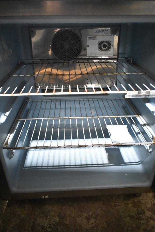 Delfield 406P-STAR2 stainless steel undercounter cooler, single door, interior view, 115V, 1 phase, adjustable shelves.