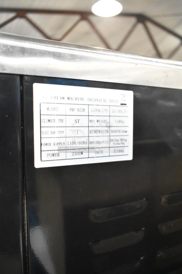 Vevor YKF-9228 stainless steel 2-flavor soft serve machine, commercial casters, 110V, 2300W. Tag shows model, capacity, power.