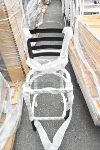 Black metal bar height ladder back chair frame, new with minor scratches and dents, wrapped in protective material.