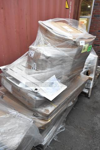 Shrink-wrapped pallet with 8 brand new scratch and dent items, including work tables and compressor, visible labels and barcodes.