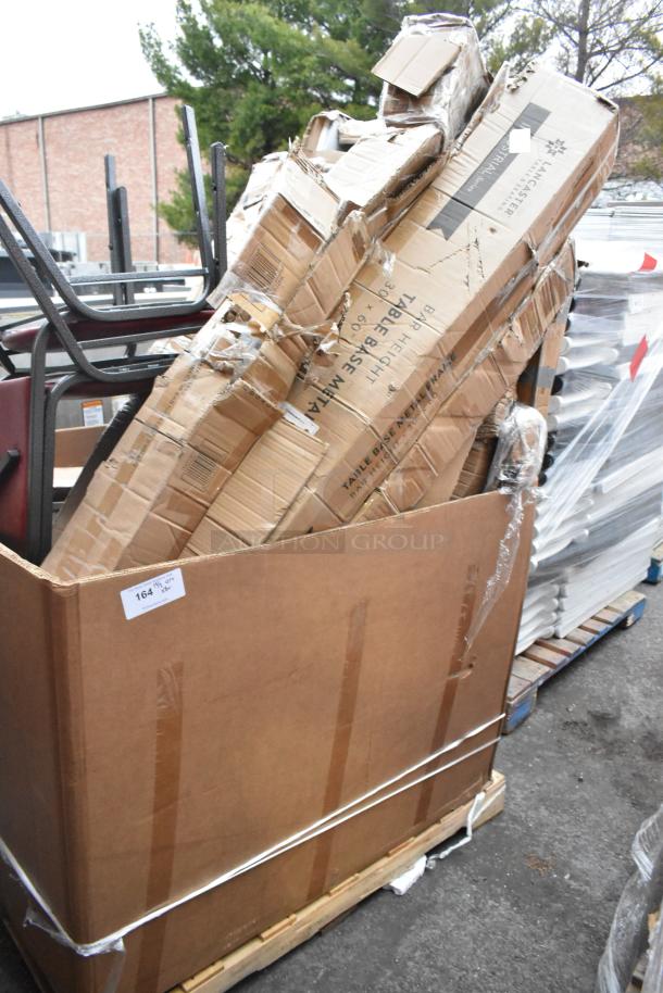 Large box of 8 brand new scratch and dent items, including chairs. Boxes visibly damaged. Label: "Table Base Material."