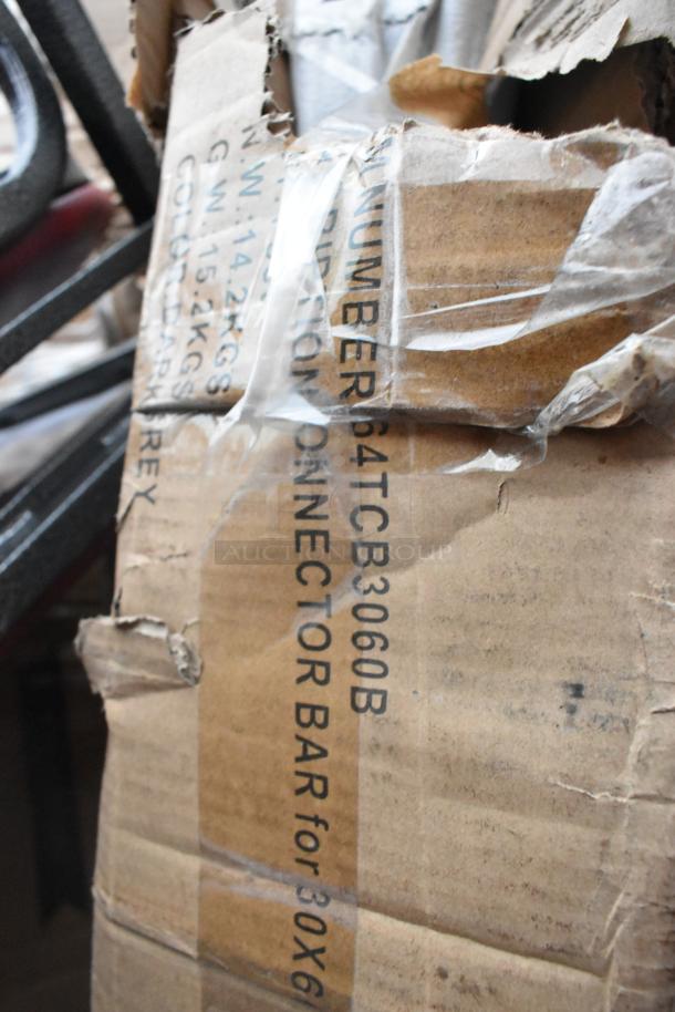 Damaged cardboard box with text "PT#64TCB3060B" and "CONNECTOR BAR for 30x6". Contains new scratch and dent items, including chairs.