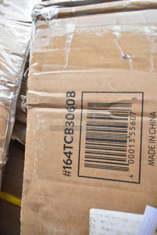 Cardboard box labeled #164TCB3060B with barcode and "Made in China" text, containing scratch and dent items including chairs.