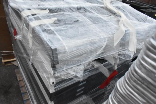 48 folding chairs, white and black, wrapped in plastic on a pallet. Auction lot, sold by bid multiplier.