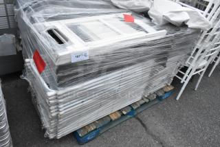 Bundle of 48 folding chairs in white and black, wrapped on pallet. Includes auction label "167," indicating quantity and lot.