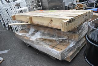 Four brand new doors in a sealed wooden crate, visible packing details suggest pristine condition.