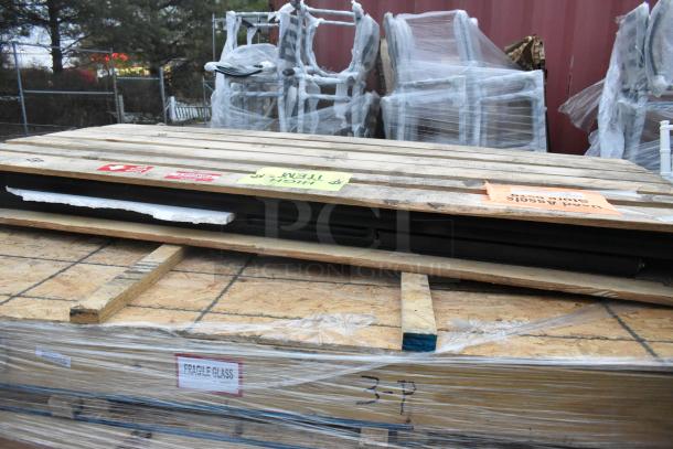 New doors in crate, sealed with protective wrap. Marked "Fragile Glass." Includes labeling for handling. Quantity: 4.