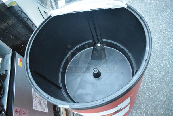 Poly portable bottle cooler, cylindrical shape, open lid, black interior. Appears in good condition, ideal for events or gatherings.