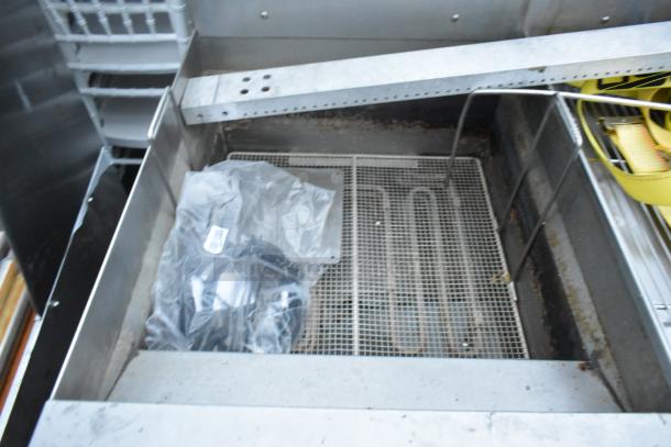 Giles EOF-24 stainless steel commercial electric 3-bay deep fat fryer, visible elements, dumping station, on casters.