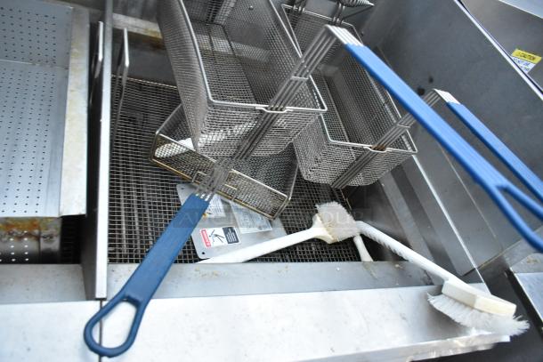 Giles EOF-24 stainless steel 3 bay deep fat fryer with dumping station, commercial casters, and labeled controls.