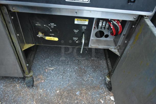 Giles EOF-24 stainless steel commercial electric 3-bay deep fat fryer with dumping station on casters, 480V, 3-phase.