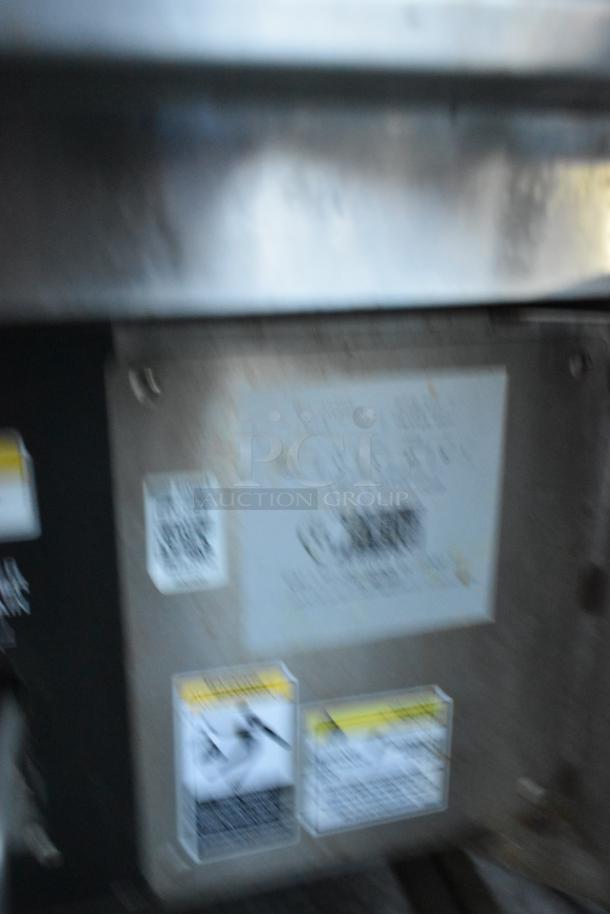 Stainless steel commercial electric 3 bay deep fat fryer, Giles EOF-24, with dumping station and casters, 480V, 3 phase.