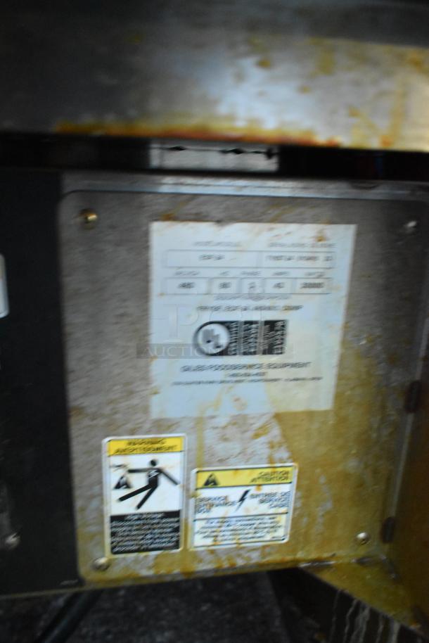 Giles EOF-24 stainless steel 3 bay deep fat fryer with dumping station, 480V, 3 phase, on commercial casters. Warning labels visible.