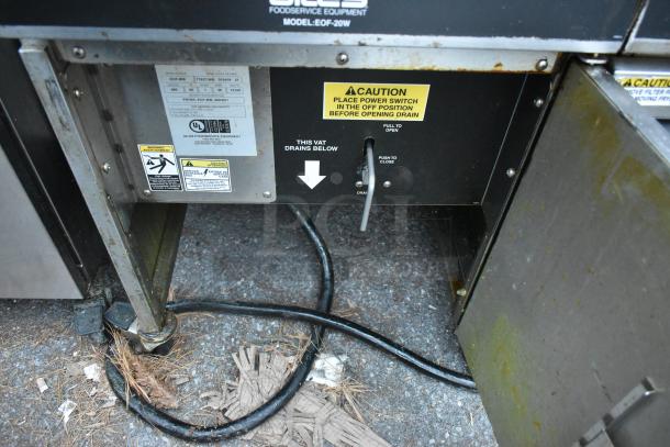 Giles EOF-24 Stainless Steel Electric Fryer, 3 bays, with dumping station and commercial casters; 480V, 3-phase. Labels show model and caution instructions.