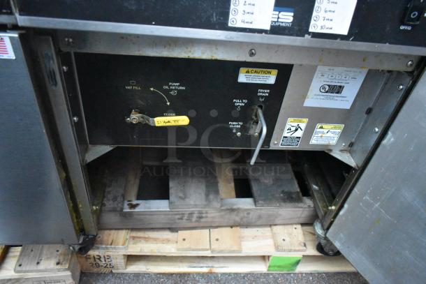 Giles EOF-24 stainless steel 3 bay electric deep fat fryer with dumping station on commercial casters, labels indicating functions.