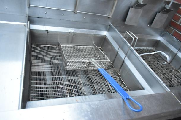 Giles EOF-24 stainless steel 3-bay deep fat fryer with dumping station, blue handle basket, on commercial casters, 480V.
