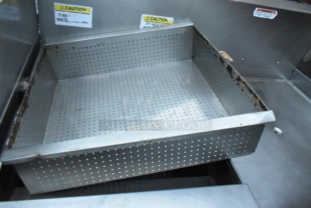Giles EOF-24 stainless steel commercial 3-bay deep fryer with dumping station, 480V, 3-phase, on casters, caution labels visible.