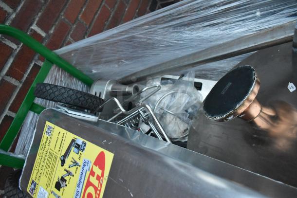 Metal green U-Boat cart with contents, including a shortening shuttle and chafer, featuring a heavy-duty wheel, and visible product label.