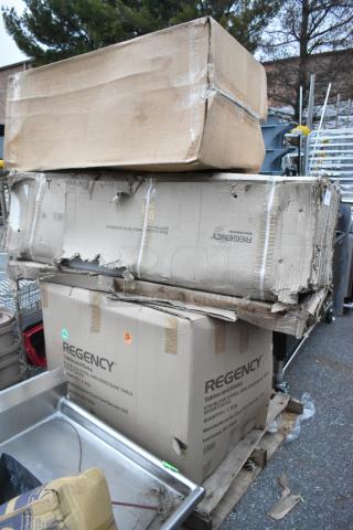 Four new Regency stainless steel items in original boxes. Boxes are dented, indicating scratch and dent condition.