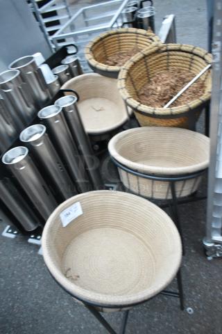 4 produce baskets on stands, woven design, various sizes, metal frames. Visible tag reads "124." Ideal for retail display.