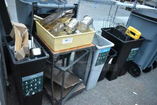 Assorted items including trash cans, bins, and a metal table. Contents feature utensils and trays. Labels indicate recycling.