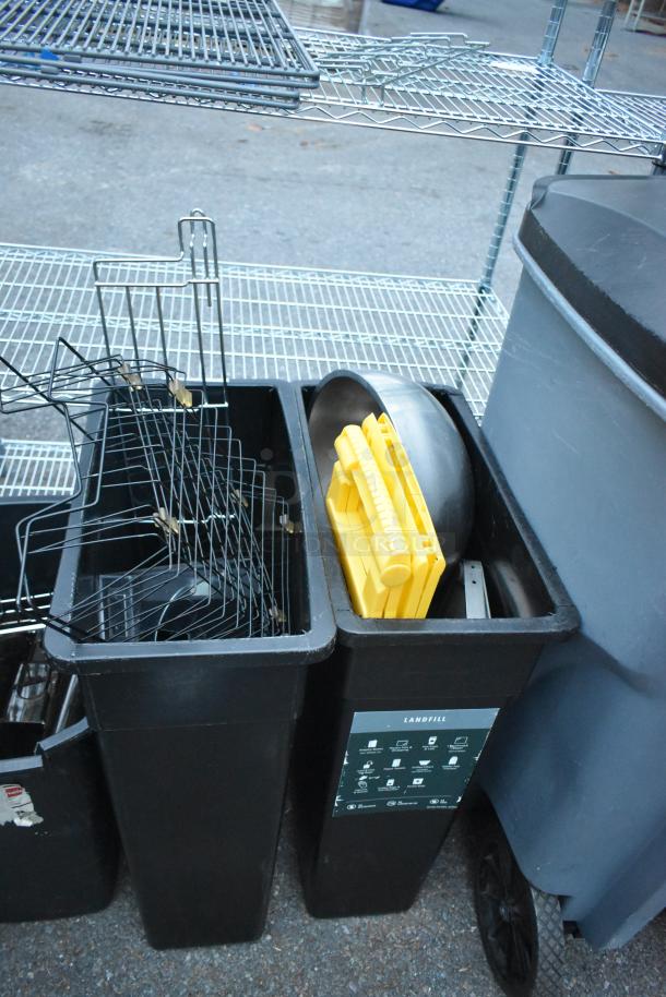 Various items including trash cans, wire racks, and a mobile bin. Includes contents such as metal grids and yellow plastic parts.
